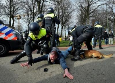 خبرنگاران پلیس هلند با معترضان ضددولتی درگیر شد